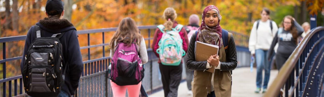 Students crossing Little Mak bridge.